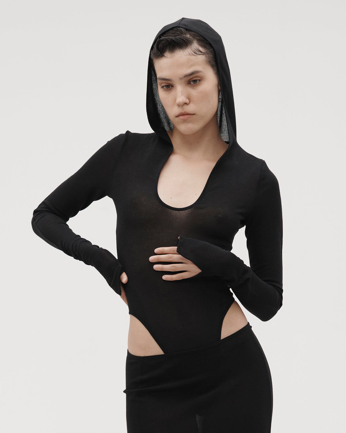 HOODED BODYSUIT IN BLACK