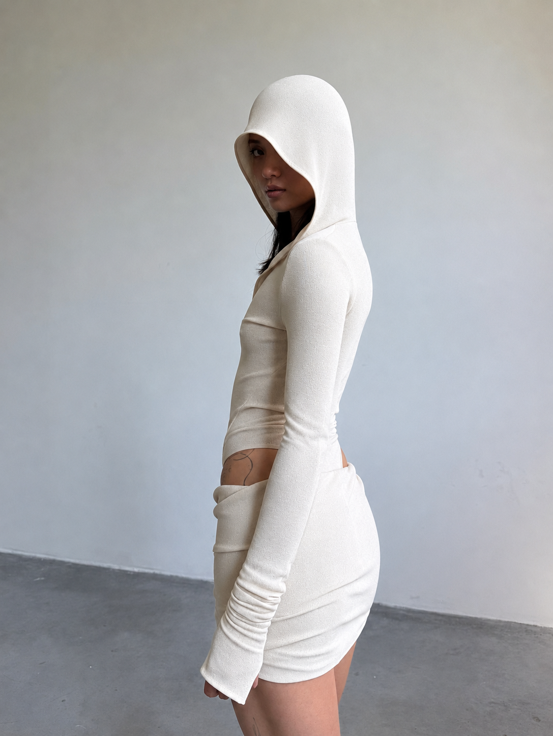 HOODED BODYSUIT IN BEIGE