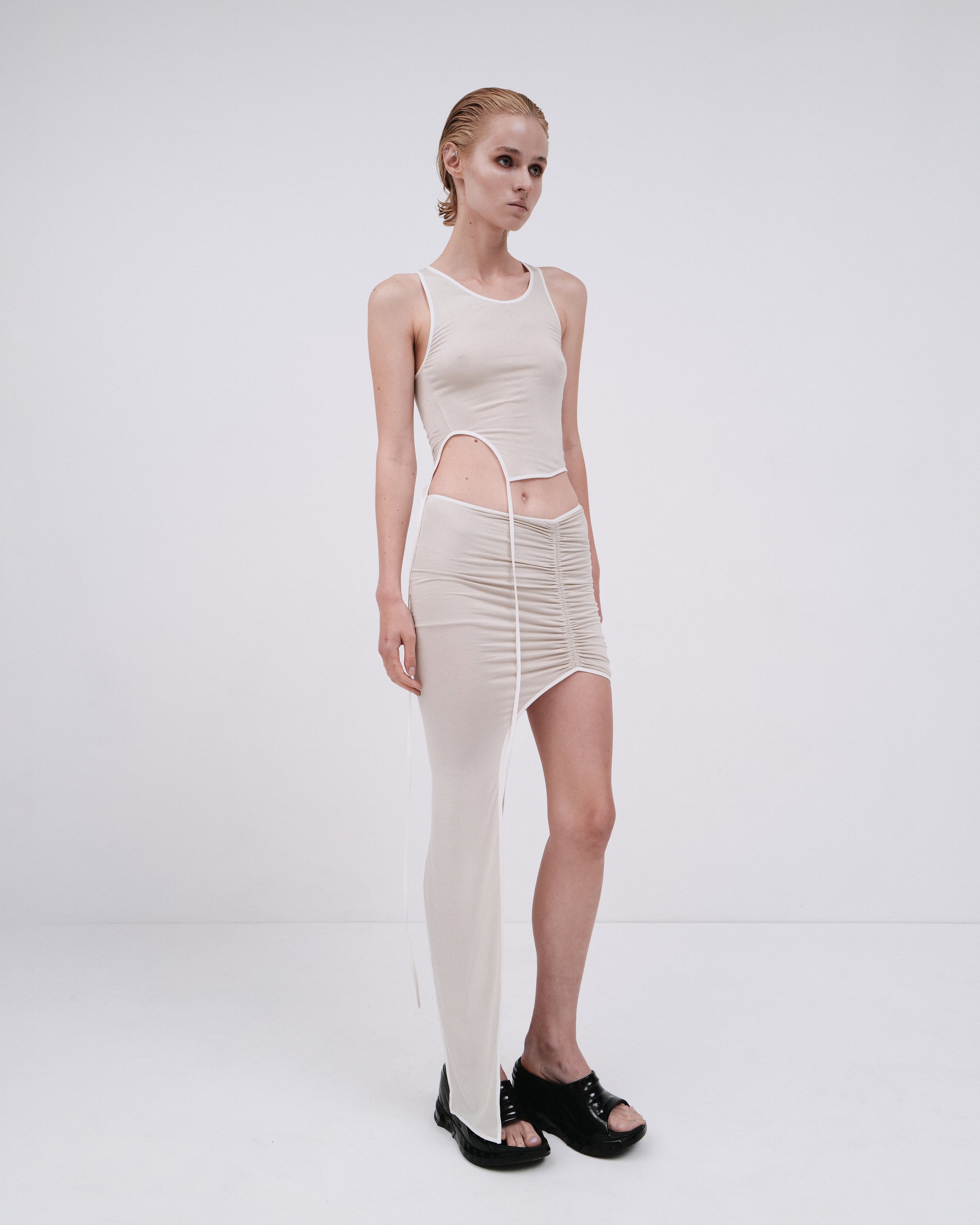 DRAPED SKIRT WITH ELONGATED DETAIL IN PEARL
